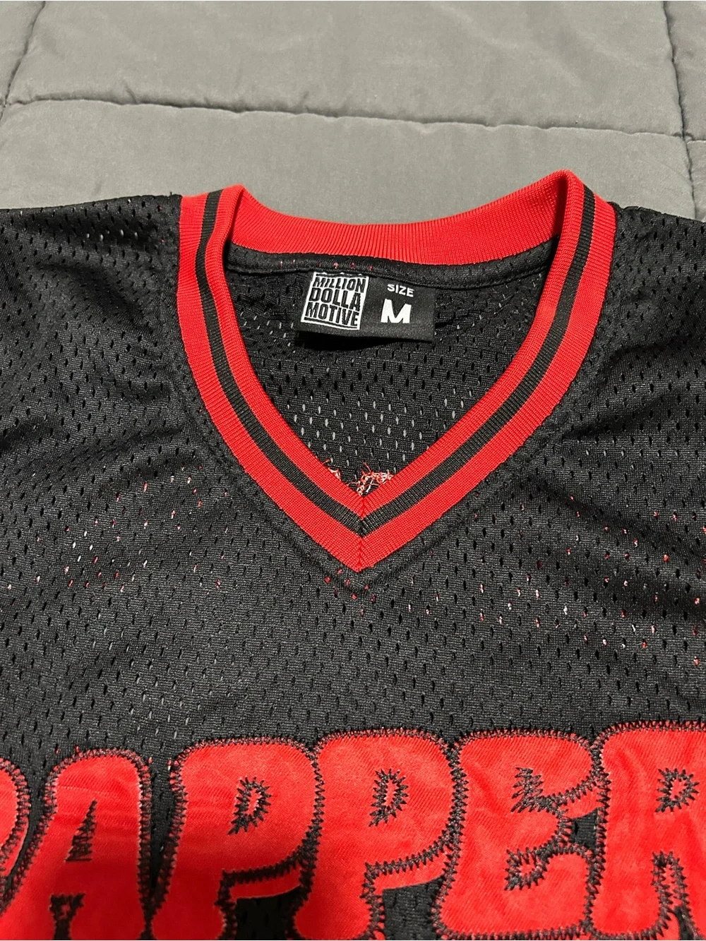 Million Dolla Motive Black & Red Mesh Sports Jersey. Size Medium